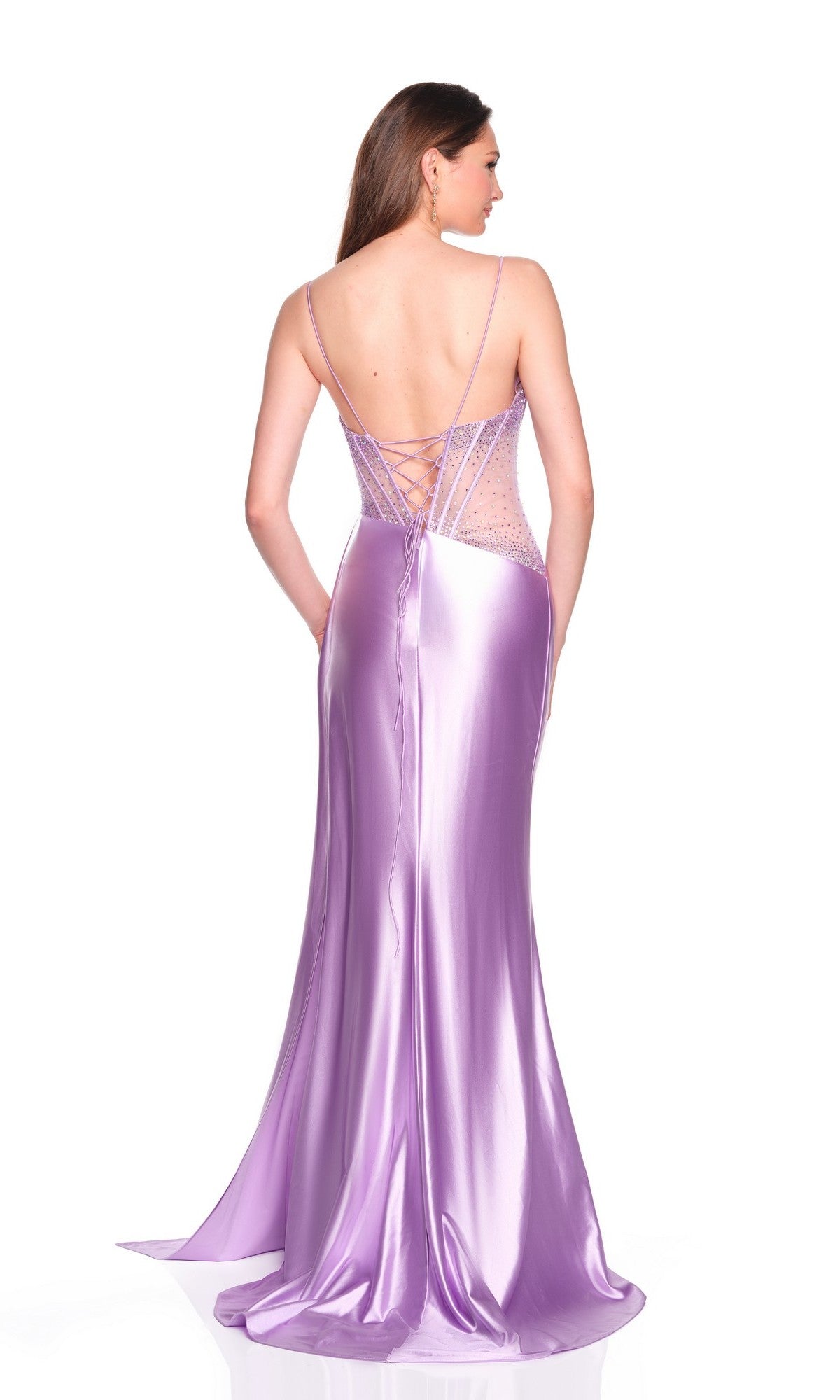 Woman in a floor-length, shimmering lavender gown with spaghetti straps, an embellished bodice, and lace-up back stands against a white backgroundโthis is the Long Prom Dress: Dave and Johnny 12786, shown elegantly from behind.